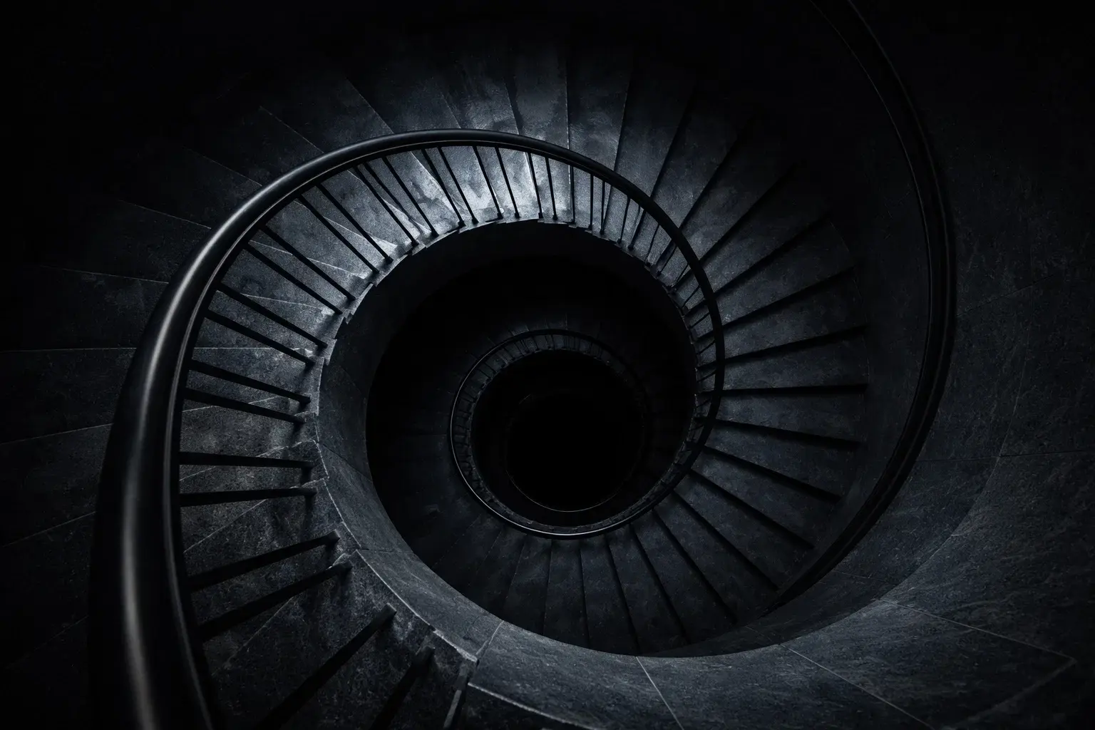 Escalier en spirale descendant représentant la spirale des pertes aux paris